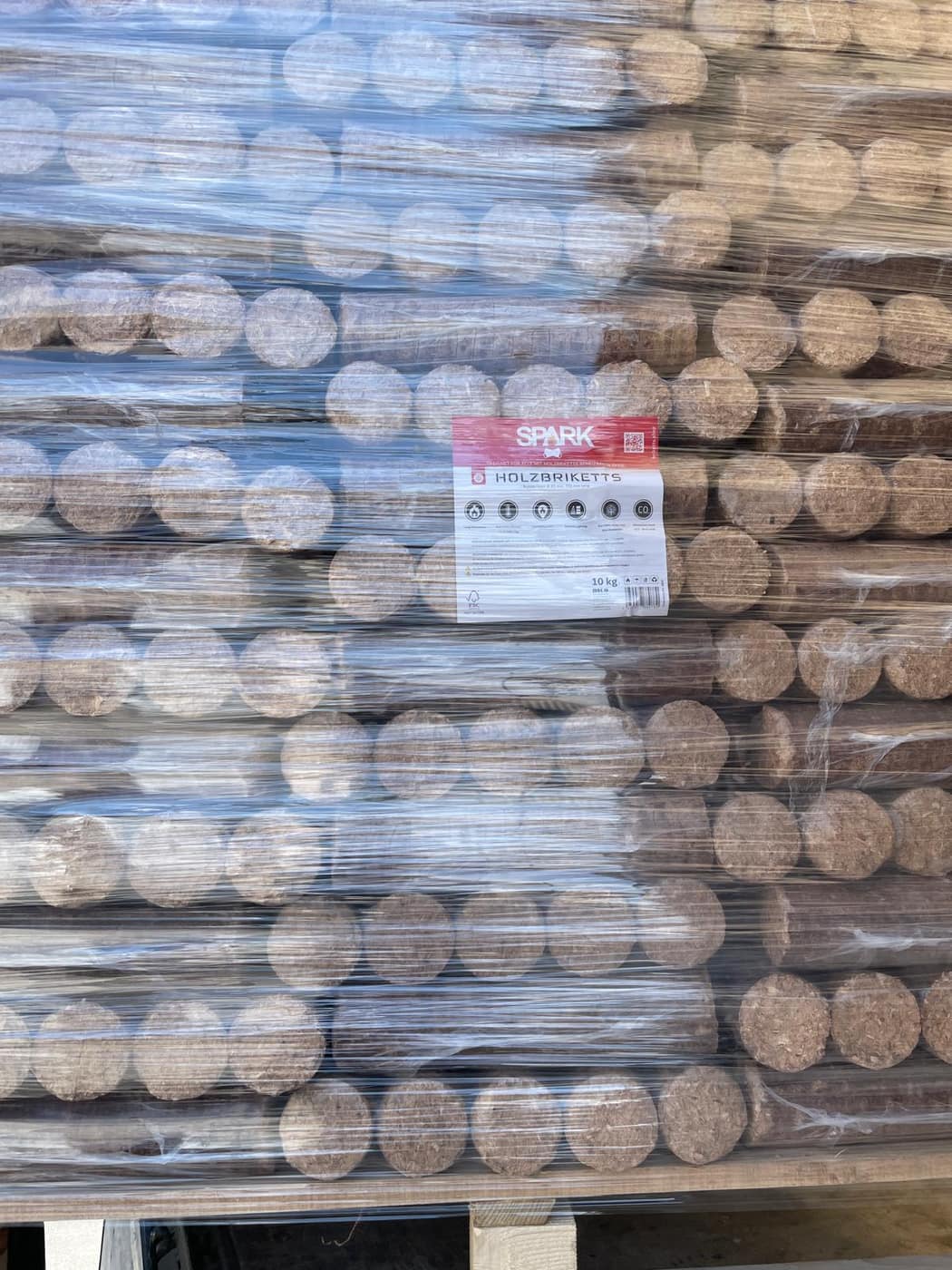 Pallet of pressed briquettes wrapped for shipping